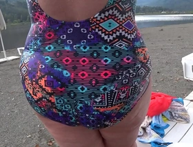 Bbw with big booty in tight jeans is dressing in a public dressing room on the beach fetish