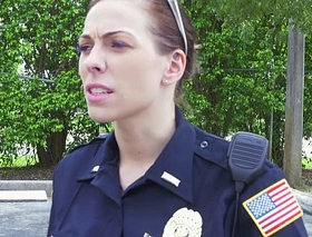Female cops entice over black suspect and suck his cock